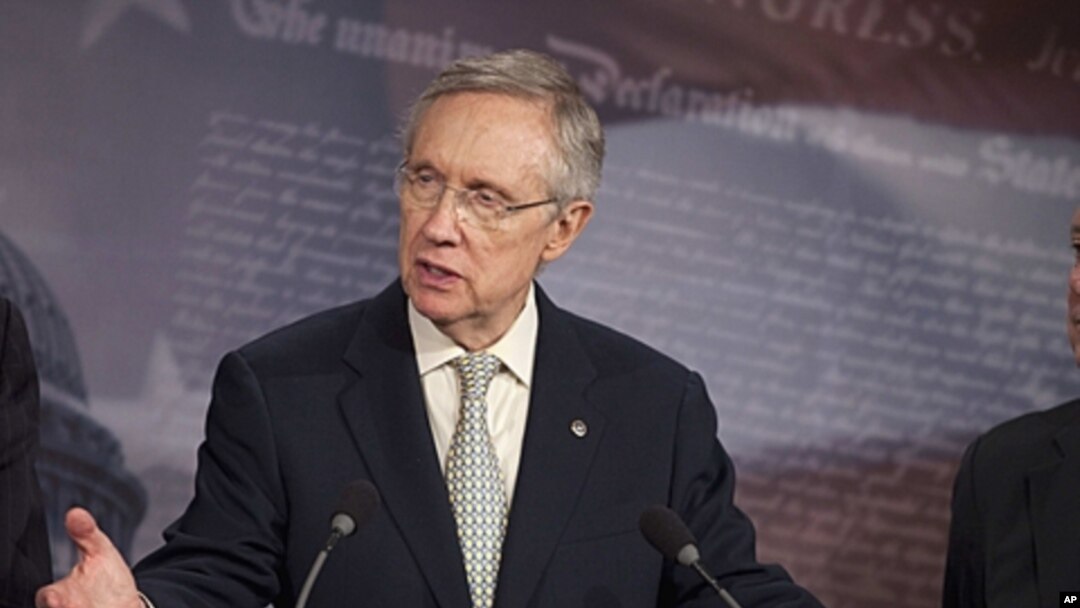 Senate Majority Leader Harry Reid gestures during a news conference on Capitol Hill in Washington, July 29, 2011