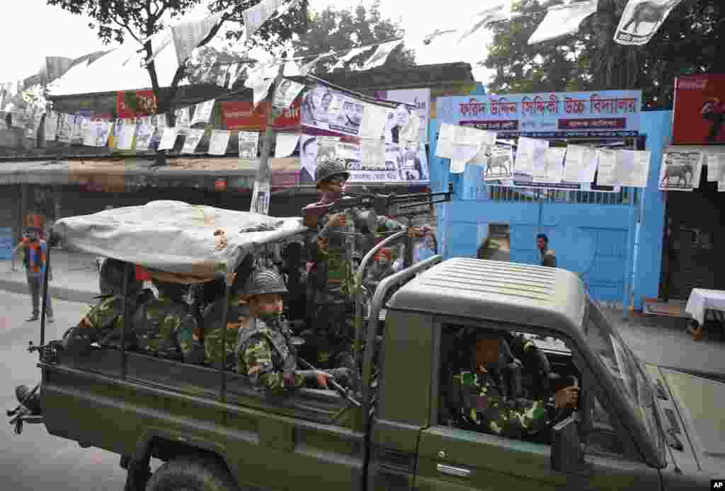 Army soldiers patrol a street during the election in Dhaka, Jan. 5, 2014. 