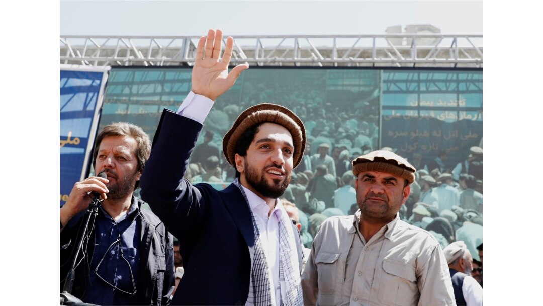 FILE - Ahmad Massoud, son of Afghanistan's slain anti-Soviet resistance hero Ahmad Shah Massoud, waves as he arrives to attend a gathering in Bazarak, Panjshir province, Afghanistan, Sept. 5, 2019.