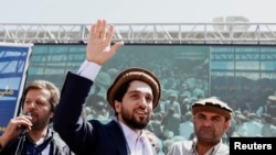 FILE - Ahmad Massoud, son of Afghanistan's slain anti-Soviet resistance hero Ahmad Shah Massoud, waves as he arrives to attend a gathering in Bazarak, Panjshir province, Afghanistan, Sept. 5, 2019. 