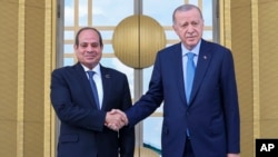 Egyptian President Abdel Fattah el-Sissi, left, shakes hands with Turkish President Recep Tayyip Erdogan during a welcome ceremony prior to their meeting at the Presidential Palace in Ankara, Turkey, on Sept. 4, 2024.