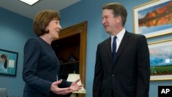 Sen. Susan Collins, R-Maine, speaks with Supreme Court nominee Judge Brett Kavanaugh at her office, before a private meeting on Capitol Hill in Washington on Aug. 21, 2018. 