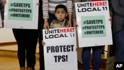 Mateo Barrera, 4 originally from El Salvador, whose family members are in the Temporary Protected Status program attend a news conference in Los Angeles, Monday, January 8, 2018. 