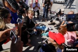 Albuquerque mayor Tim Keller leaves a stuff animal outside of the children's tent encampment built to deal with the Trump administrations "zero tolerance" policy in Tornillo, Texas, June 21, 2018.
