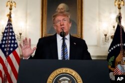 President Donald Trump delivers a statement on the mass shooting at a South Florida High School from the White House, Feb. 15, 2018, in Washington.