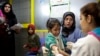 FILE - A Syrian girl weeps after receiving the measles vaccine from UNICEF nurses at the U.N. refugee agency's registration center in Zahleh, in Lebanon's Bekaa Valley.