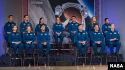 In this January 10, 2020 photo, the 2017 Class of Astronauts participate in graduation ceremonies at the Johnson Space Center in Houston, Texas. 