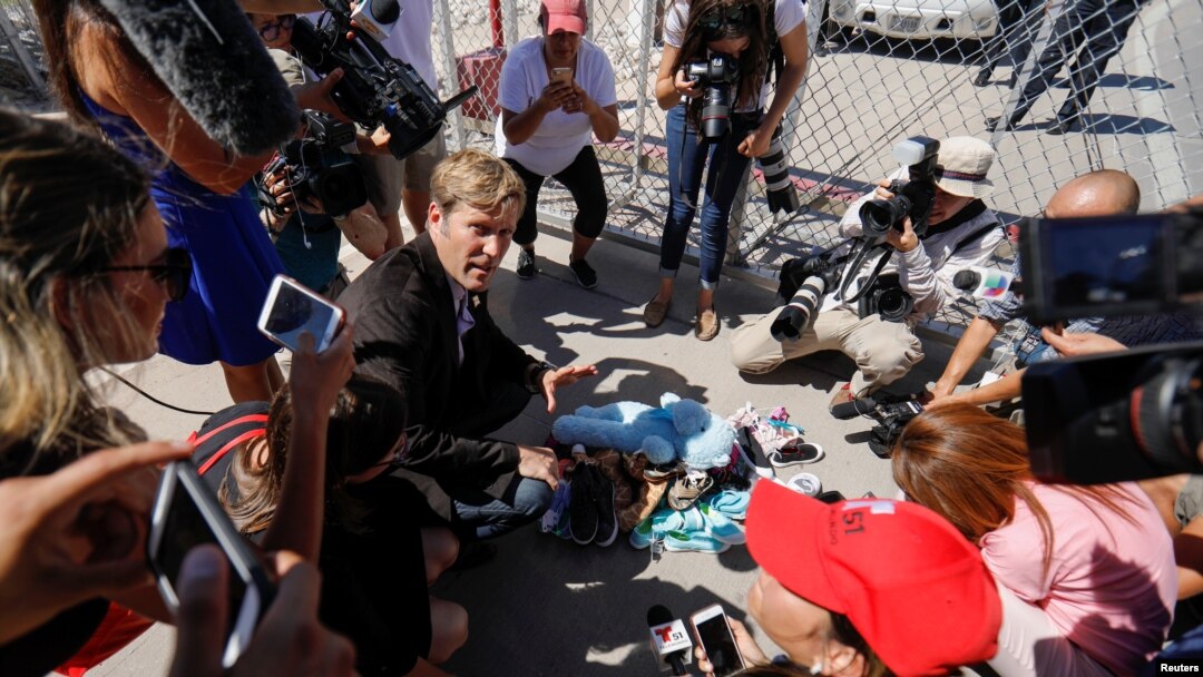 Albuquerque mayor Tim Keller leaves a stuff animal outside of the children's tent encampment built to deal with the Trump administrations "zero tolerance" policy in Tornillo, Texas, U.S. June 21, 2018.