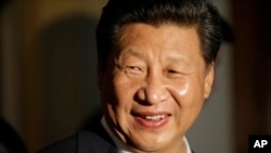 Chinese President Xi Jinping smiles as he concludes a visit to Lincoln High School, Sept. 23, 2015.