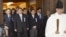 Japanese lawmakers, including cabinet ministers, are led by a Shinto priest as they visit the Yasukuni Shrine for the war dead in Tokyo, October 18, 2012.
