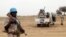 FILE - U.N. peacekeepers stand guard in the northern town of Kouroume, Mali, May 13, 2015.