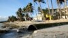 A man walks beside a drainage pipe that discharges its untreated sewage into the waters along the beachfront of the country's most famous beach resort island of Boracay, in central Aklan province, Philippines, as the government implements it's temporary c