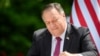 FILE - US Secretary of State Mike Pompeo signs an agreement on fifth-generation internet technology with Slovenia's Foreign Minister Anze Logar in Bled, Slovenia, Aug. 13, 2020.