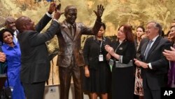 South Africa President Cyril Ramaphosa, left, United Nations General Assembly President Maria Fernanda Espinosa, center, and United Nations Secretary General Antonio Guterres attend the unveiling ceremony of the Nelson Mandela Statue which was presented as a gift from the Republic of South Africa at United Nations headquarters, Sept. 24, 2018.