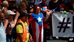 Thousands of Puerto Ricans gather for what many are expecting to be one of the biggest protests ever seen in the U.S. territory, with irate islanders pledging to drive Gov. Ricardo Rossello from office, in San Juan, Puerto Rico, July 22, 2019.