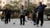 Retirees practice "Cola Ball" with music, an invented community activity in central Beijing, Oct. 17, 2013. China is close to announcing long-awaited reforms to its pension system, whose assets are estimated to have already fallen $3 trillion behind projected future payouts.