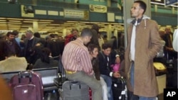 Passengers pack Tripoli's International airport as they try to catch flights leaving Libya. European countries are sending planes and ferries to Libya to evacuate their citizens, February 22, 2011
