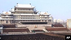 Photo released by the Korean Central News Agency and distributed in Tokyo by the Korea News Service, thousands take part in a national memorial service for late North Korean leader Kim Jong Il in Pyongyang, December 29, 2011.