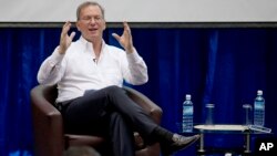 Google Executive Chairman Eric Schmidt gestures during an interactive session with group of students at a technical university in Rangoon, Burma, March 22, 2013.