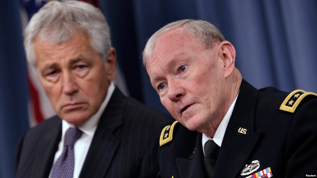 U.S. Secretary of Defense Chuck Hagel (L) and Joint Chiefs of Staff General Martin Dempsey hold a joint news conference at the Pentagon in Washington, March 17, 2013.