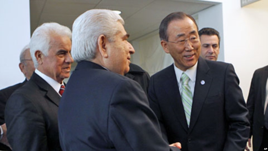 United Nations Secretary-General Ban Ki-moon (R) speaks with Greek Cypriot leader Dimitris Christofias (C) and his Turkish Cypriot counterpart Dervis Eroglu (L) following their meetings at United Nations headquarters in New York, January 25, 2012