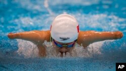 Daomin Liu competes at Women&#39;s 200m Individual Medley - SM6 Heat 1 at the Tokyo Aquatics Centre during the Tokyo 2020 Paralympic Games, Thursday, Aug. 26, 2021, in Tokyo, Japan. (AP Photo/Emilio Morenatti)