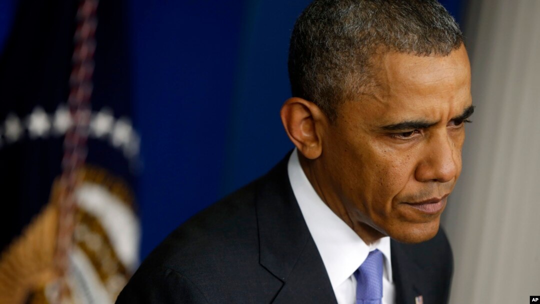 President Barack Obama listens to a question from a reporter at the White House in Washington, May 21, 2014, after he met with Veterans Affairs Secretary Eric Shinseki and Deputy Chief of Staff Rob Nabors.