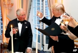 FILE - President Donald Trump and Britain's Prince Charles toast at Winfield House, the residence of the U.S. ambassador to the U.K., in Regent's Park, part of the president's state visit to the U.K., in London, June 4, 2019.