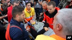 在西班牙的加泰罗尼亚的警民冲突中受伤的一位妇女（2017年10月1日）