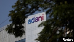 FILE - The logo of the Adani Group is seen on the facade of its Corporate House on the outskirts of Ahmedabad, India, Nov. 21, 2024. 