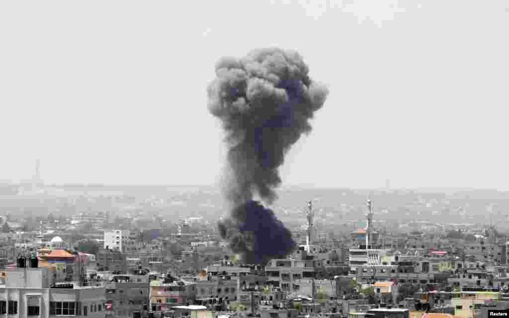 Smoke rises following what witnesses said was an Israeli air strike in Gaza City July 8, 2014.