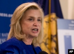 FILE - Rep. Carolyn Maloney, D-N.Y. left, accompanied by actress and pay equity advocate Patricia Arquette, speaks during a National Press Club Newsmaker news conference, on Equal Pay Day, April 12, 2016, at the National Press Club in Washington.