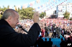 FILE - Turkey's President Recep Tayyip Erdogan speaks during an election rally of his ruling Justice and Development Party, in Burdur, Turkey, Feb. 18, 2019.
