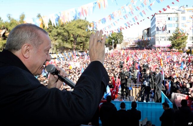 FILE - Turkey's President Recep Tayyip Erdogan speaks during an election rally of his ruling Justice and Development Party, in Burdur, Turkey, Feb. 18, 2019.