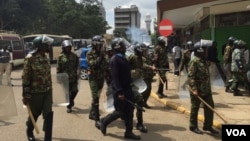 Nairobi anti-riot police disperse small groups of protesters with tear gas ahead of anti-electoral commission demonstrations, May 23, 2016. (Jill Craig/VOA)