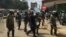Nairobi anti-riot police disperse small groups of protesters with tear gas ahead of anti-electoral commission demonstrations, May 23, 2016. (Jill Craig/VOA)