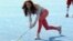 March 15, 2012. Britain's Catherine, Duchess of Cambridge plays hockey with the Team GB hockey teams at Riverside Arena in the Olympic Park in London.