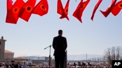 Kosovo president Hashim Thaci addresses the crowd gathered during the 20th anniversary of the NATO bombing in the village of Glogjan, Kosovo on March 24, 2019. 