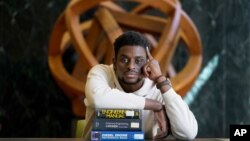 Illinois Institute of Technology student Wofai Ewa, originally from Nigeria, poses for a portrait Friday, Sept. 18, 2020, at the institute's library in Chicago. America was always considered the premiere destination for international students, with…