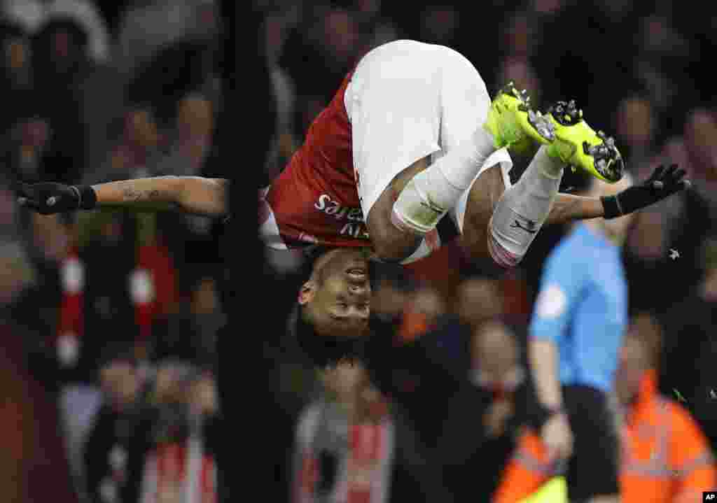 Arsenal&#39;s Pierre-Emerick Aubameyang celebrates after scoring his side&#39;s fourth goal during the English Premier League soccer match between Arsenal and Fulham at Emirates stadium in London.