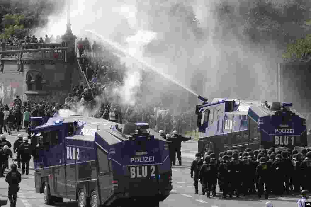 Police use a water cannon to clear a road of protesters on the first day of the G-20 summit in Hamburg, northern Germany. The leaders of the group of 20 meet July 7 and 8.