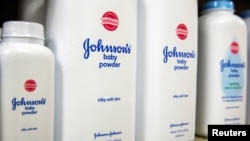 FILE - Bottles of Johnson & Johnson baby powder line a drugstore shelf in New York, Oct. 15, 2015. 