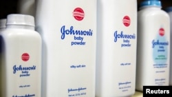 FILE - Bottles of Johnson & Johnson baby powder line a drugstore shelf in New York, Oct. 15, 2015. 