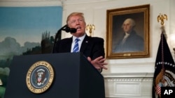 President Donald Trump speaks about his trip to Asia in the Diplomatic Reception Room of the White House, Nov. 15, 2017, in Washington.