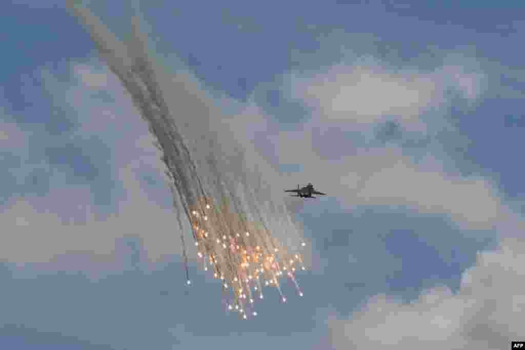 A Singapore Air Force F-15SG fighter jet participates in an aerial display at the Singapore Airshow.