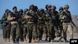 Afghan National Army soldiers march during training by Italian soldiers from NATO's Resolute Support Mission at a Military Training center on the outskirts of Herat, Feb. 9, 2017. 