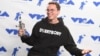 Logic poses in the press room with the award for best fight against the system for "Black SpiderMan" at the MTV Video Music Awards at The Forum on Aug. 27, 2017, in Inglewood, Calif.