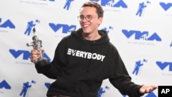 Logic poses in the press room with the award for best fight against the system for "Black SpiderMan" at the MTV Video Music Awards at The Forum on Aug. 27, 2017, in Inglewood, Calif.