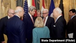 U.S. Secretary of State John Kerry chats with German Foreign Minister Frank-Walter Steinmeier, United Nations Special Envoy for Syria Staffan de Mistura, and Assistant Secretary of State for Near Eastern Affairs Anne Patterson on October 30, 2015, at the 