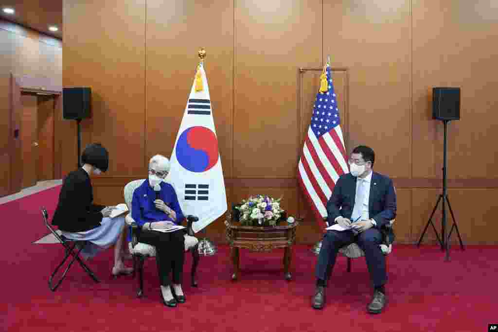 In this photo provided by South Korea Foreign Ministry, U.S. Deputy Secretary of State Wendy Sherman, second from left, talks to journalists as South Korean First Vice Foreign Minister Choi Jong Kun listens after their meeting at the Foreign Ministry in S